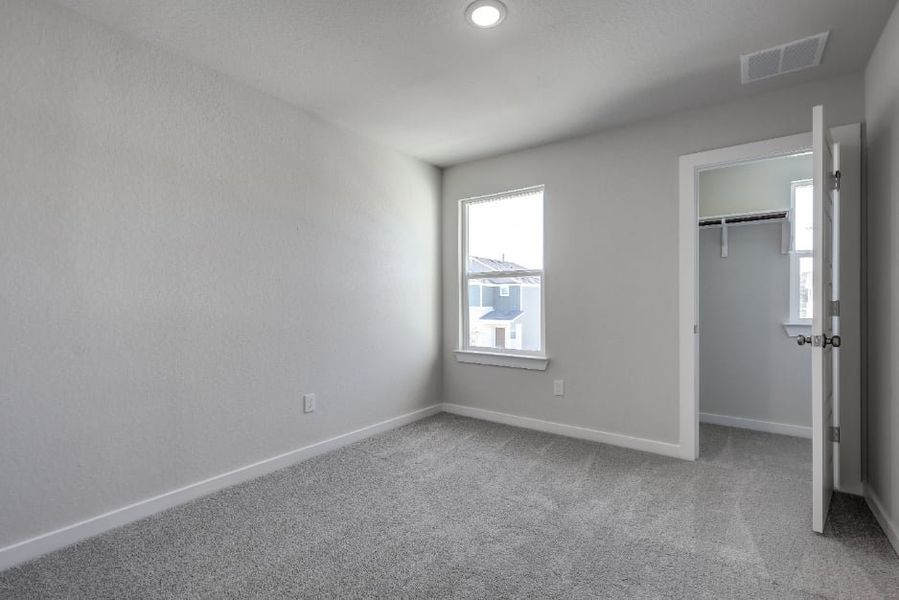 A room with a window and a door. A room with a window and a door.