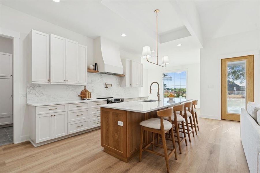 Two tone kitchen with custom-ordered soft close cabinets shipped from South Carolina. So much storage, and plenty of seating at the island.