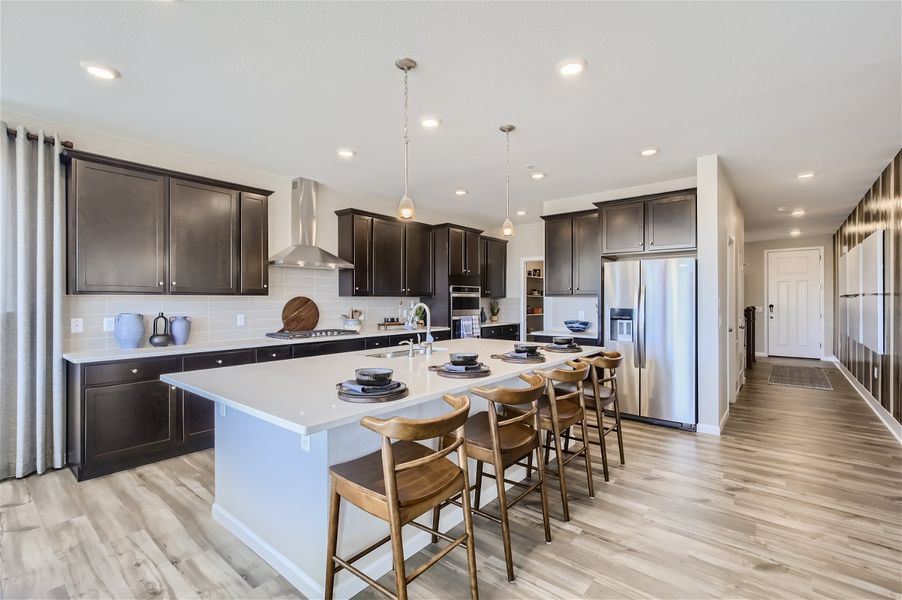 A kitchen with a large island. A kitchen with a large island.