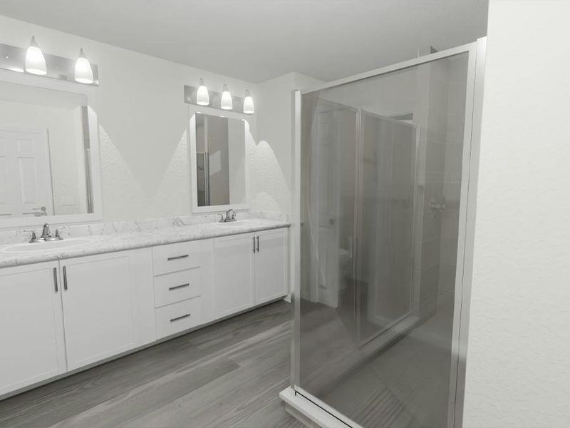 Your suite is complete with a large en-suite bath with dual vanities, a tiled shower, a linen closet, and a closeted toilet. (Artist`s rendering)