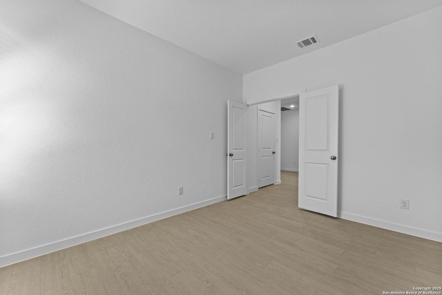 Spacious, unfurnished interior of a new home in Waterwheel: Coastline Collection, San Antonio (Image 17).