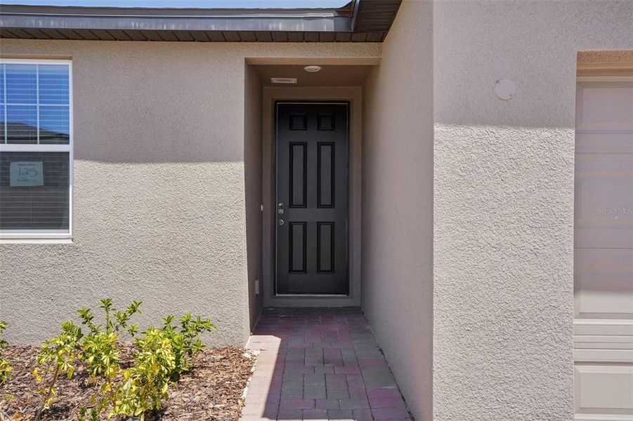 Exterior details and patio area of a home in Lake Deer Estates - Signature Series, Poinciana (Image 3). Exterior details and patio area of a home in Lake Deer Estates - Signature Series, Poinciana (Image 3).