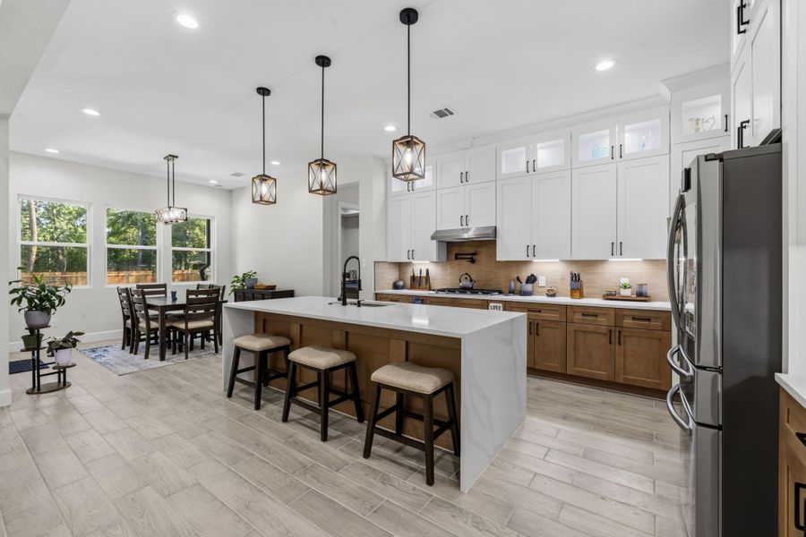 Furnished interior view inside a new home in , Roman Forest (Image 12).