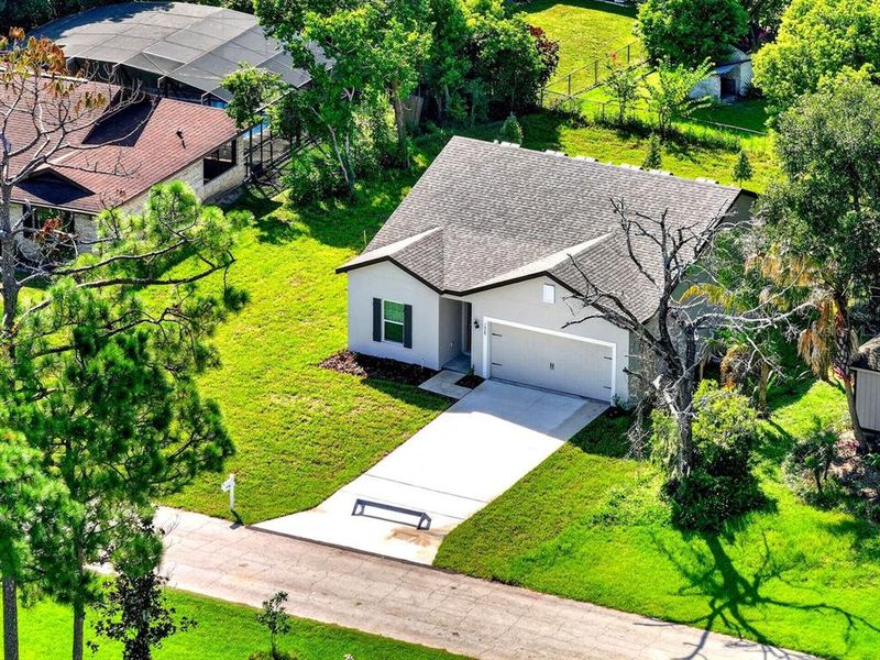 Front exterior of a new home in , Deltona, FL, highlighting curb appeal (Image 15). Front exterior of a new home in , Deltona, FL, highlighting curb appeal (Image 15).