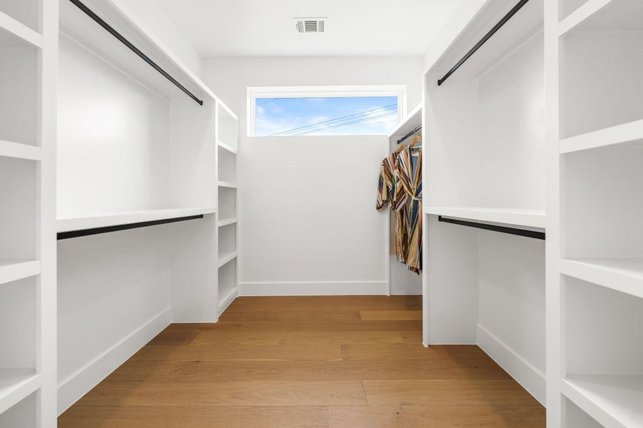 1 of 2 primary walk in closets