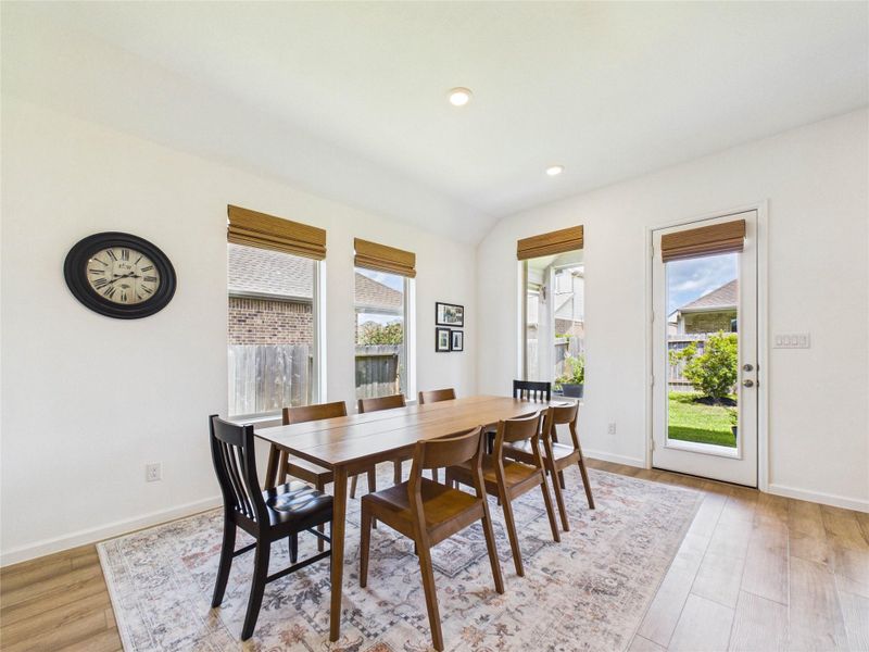 The dining area offers ample space for a large table, comfortably accommodating seating for up to eight. With direct access to the covered patio and backyard, it’s perfect for indoor-outdoor entertaining and everyday family meals.