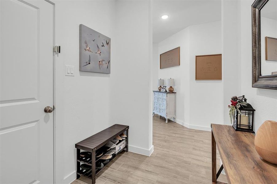 Corridor featuring light hardwood / wood-style flooring