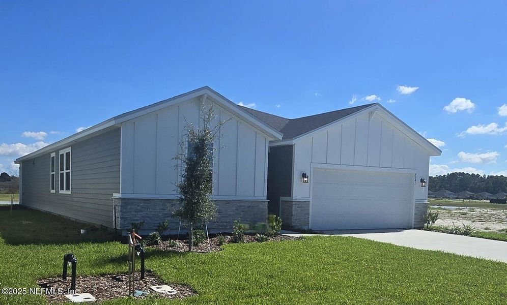 Front exterior of a new home in Cypress Meadows - Signature Series, Jacksonville, FL, highlighting curb appeal (Image 15).