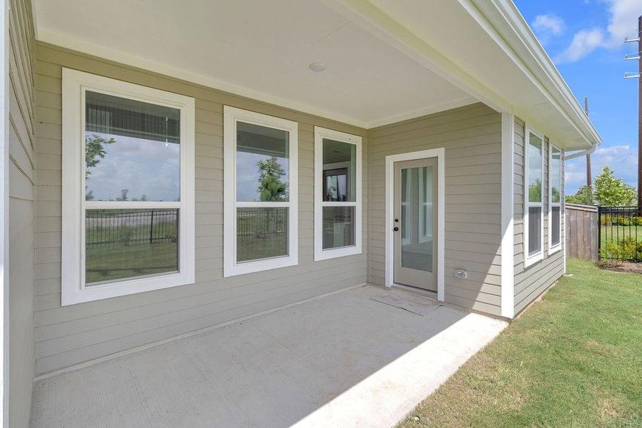This covered patio isn’t just an extension of your home; it’s a place where you can truly connect with nature and the people you love.