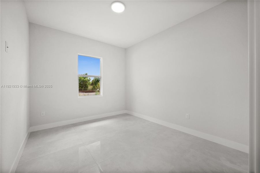 Empty room featuring baseboards Empty room featuring baseboards
