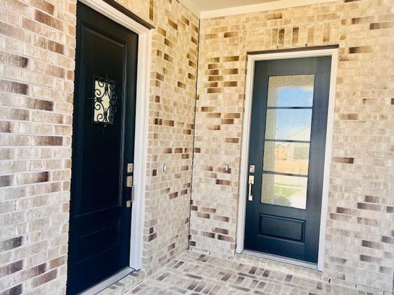 Exterior details and patio area of a home in Jordan Ranch: Pinnacle Collection, Fulshear (Image 3).