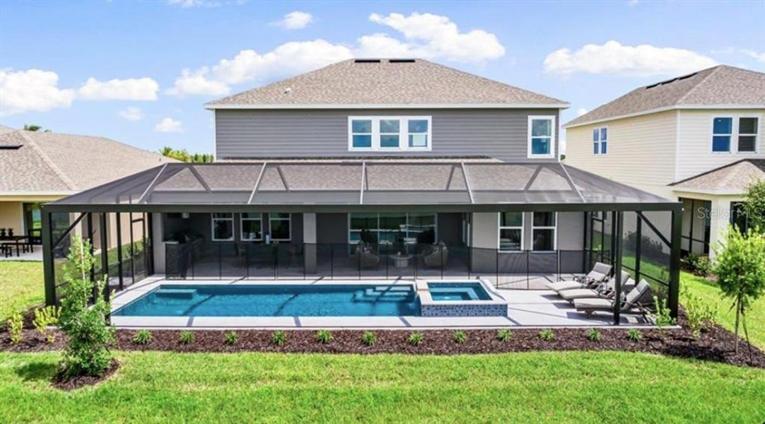 Front exterior of a new home in Firethorn, Parrish, FL, highlighting curb appeal (Image 1).