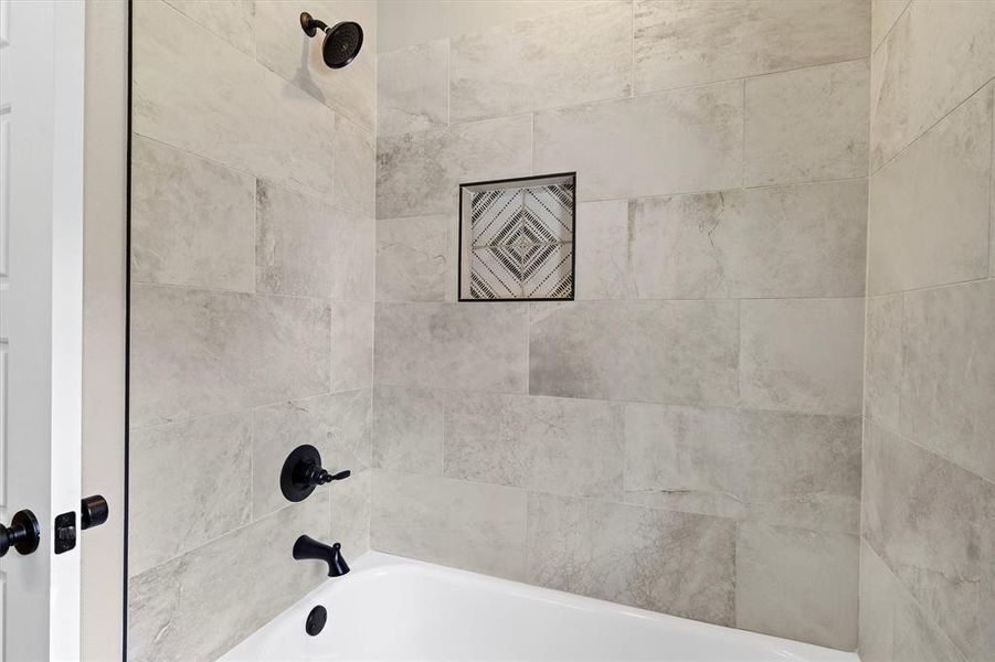 Bathroom featuring shower combination Bathroom featuring shower combination