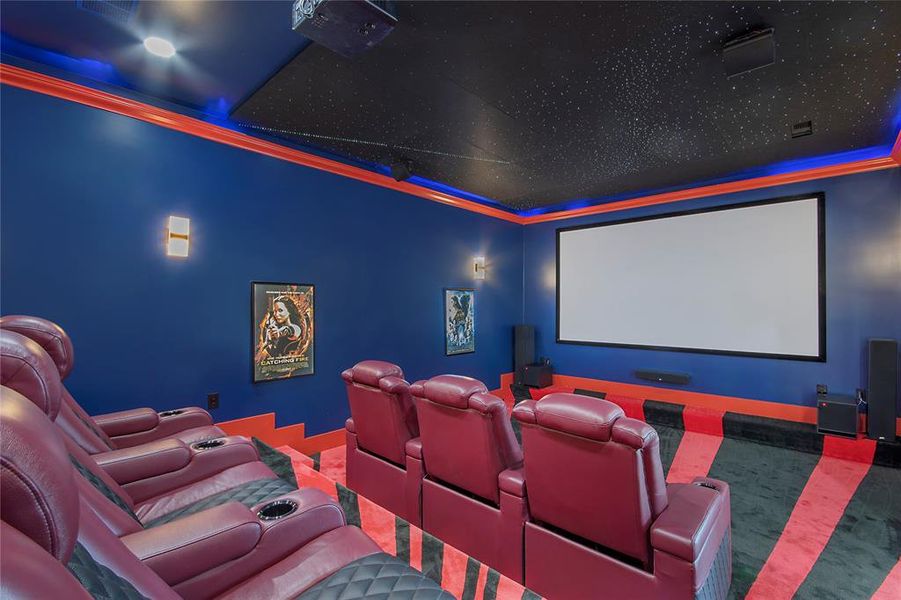 Carpeted home theater room with ornamental molding Carpeted home theater room with ornamental molding