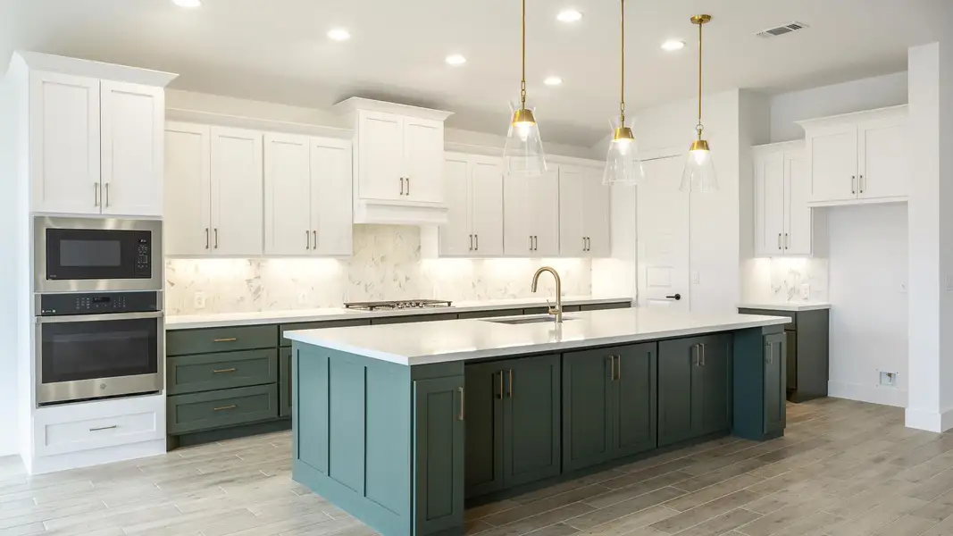 Kitchen with white cabinetry, recessed lighting, appliances with stainless steel finishes, and tasteful backsplash Kitchen with white cabinetry, recessed lighting, appliances with stainless steel finishes, and tasteful backsplash