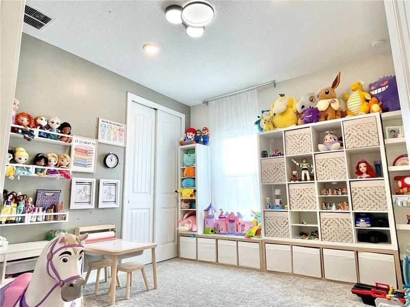 Furnished interior view inside a new home in Parkview Reserve, Orlando (Image 15).