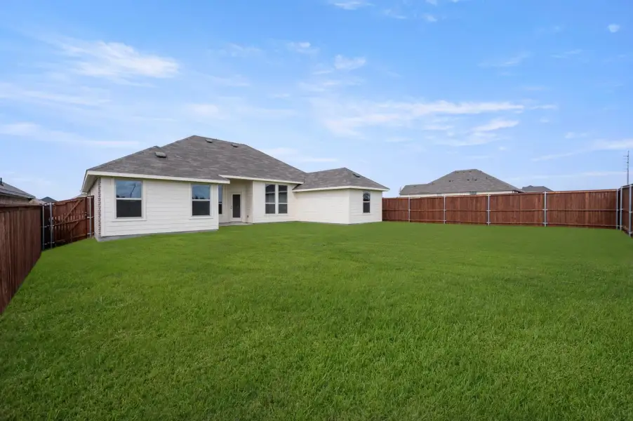 Front exterior of a new home in Still Water Lake Estates, Godley, TX, highlighting curb appeal (Image 26).