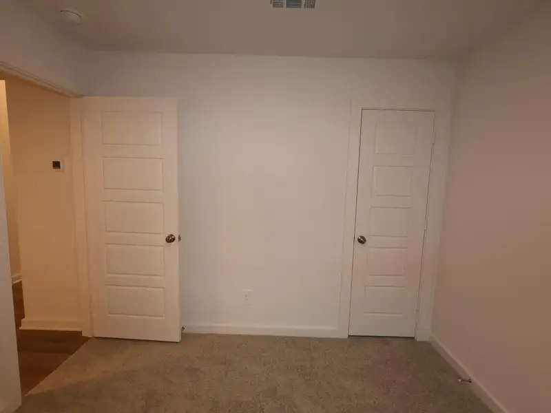 Spacious, unfurnished interior of a new home in Pinewood at Grand Texas, New Caney (Image 6).