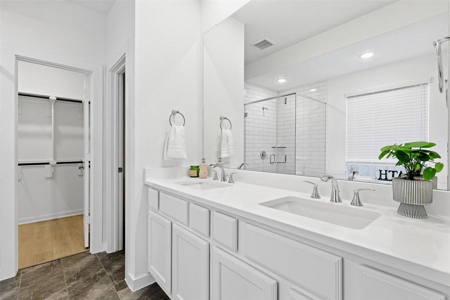 Double sinks and generous walk-in closet Double sinks and generous walk-in closet