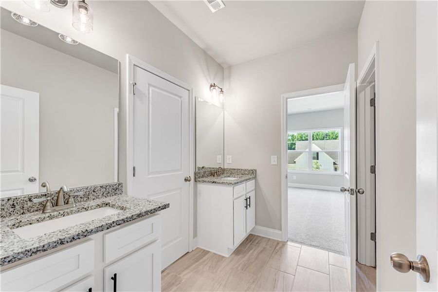 Furnished interior view inside a new home in Hidden Fields, Hoschton (Image 14).