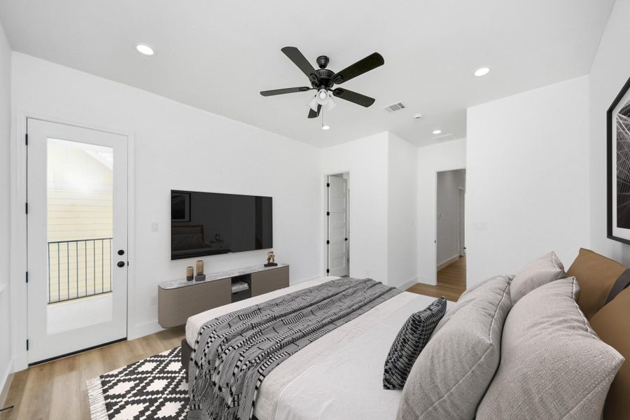 Spacious primary bedroom w/ private balcony. Spacious primary bedroom w/ private balcony.