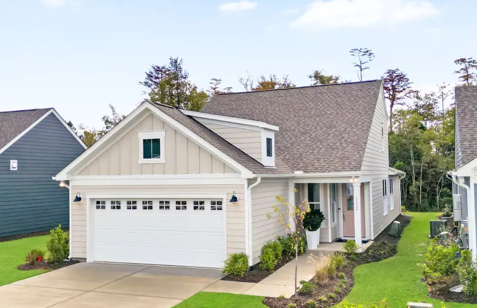 Front exterior of a new home in Del Webb Wilmington at Mallory Creek, Leland, NC, highlighting curb appeal (Image 1).