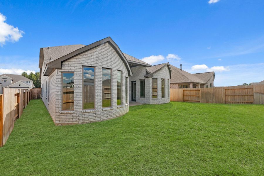 Exterior details and patio area of a home in The Trails, New Caney (Image 31). Exterior details and patio area of a home in The Trails, New Caney (Image 31).