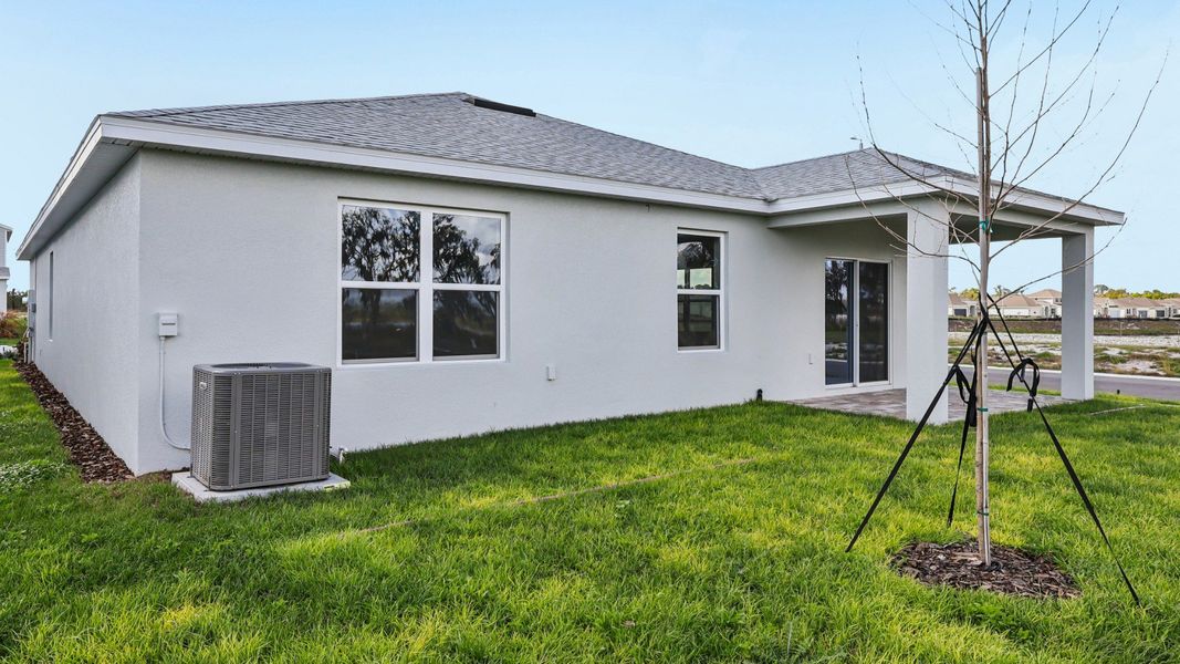 Representative exterior photo of a completed home built from the Castaway Multi-Gen by DRB Homes in Hamilton Bluff, Haines City, FL (Image 24).
