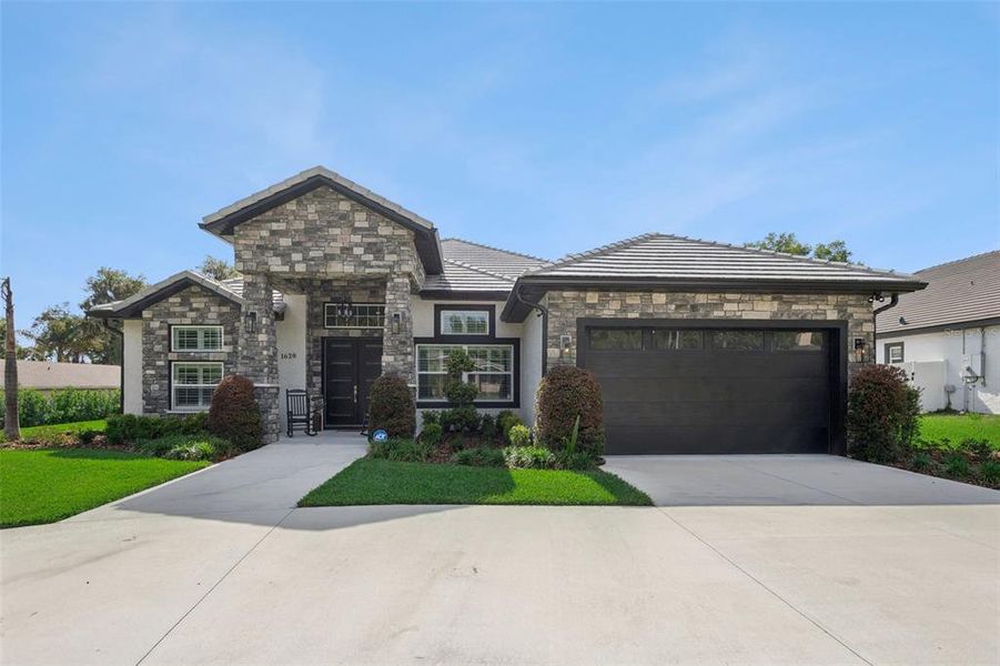 Front exterior of a new home in , Clermont, FL, highlighting curb appeal (Image 2).