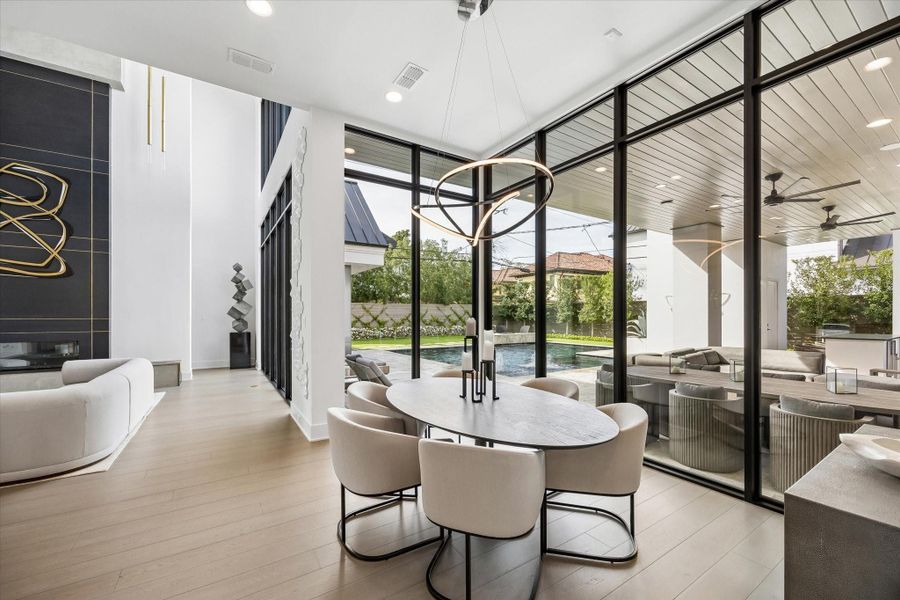 The breakfast room overlooks the pool and outdoor space. The breakfast room overlooks the pool and outdoor space.