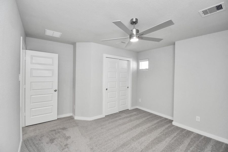 Generously sized secondary bedrooms featuring spacious closets, soft and inviting carpeting underfoot, large windows allowing plenty of natural light, and the added touch of privacy blinds for your personal retreat. Sample photo of completed home with similar floor plan. Actual colors and selections may vary. Generously sized secondary bedrooms featuring spacious closets, soft and inviting carpeting underfoot, large windows allowing plenty of natural light, and the added touch of privacy blinds for your personal retreat. Sample photo of completed home with similar floor plan. Actual colors and selections may vary.