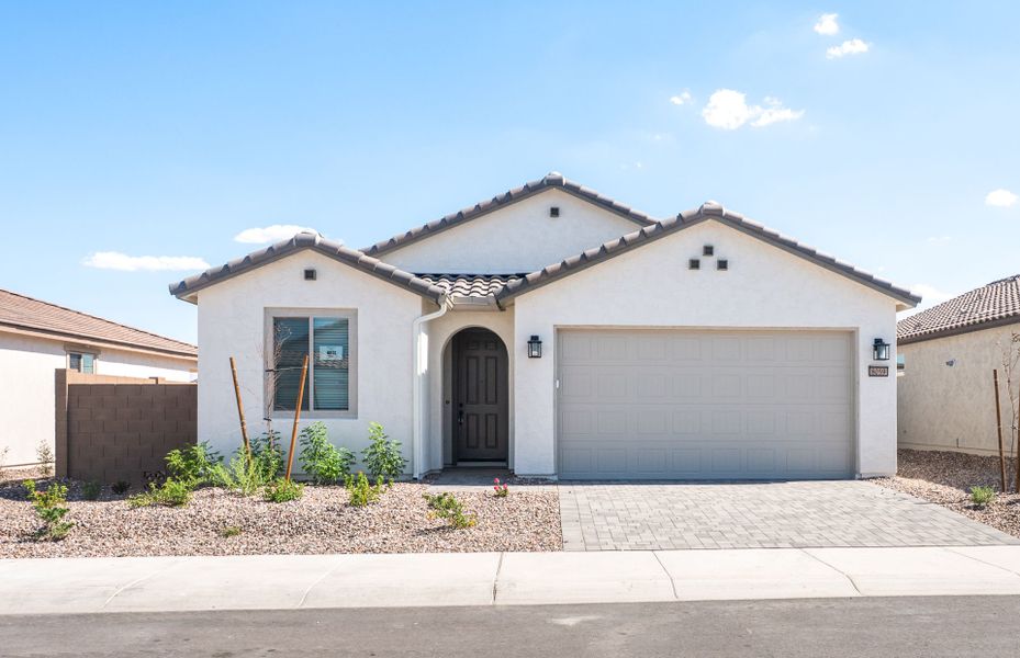 Front exterior of a new home in Sun City Anthem at Merrill Ranch, Florence, AZ, highlighting curb appeal (Image 2). Front exterior of a new home in Sun City Anthem at Merrill Ranch, Florence, AZ, highlighting curb appeal (Image 2).