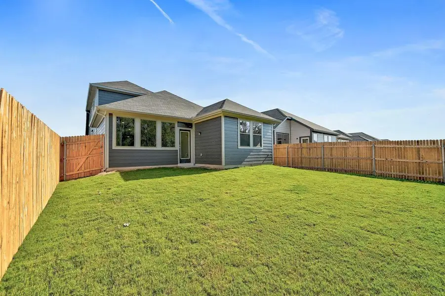 Exterior details and patio area of a home in Trinity Ranch, Elgin (Image 4).