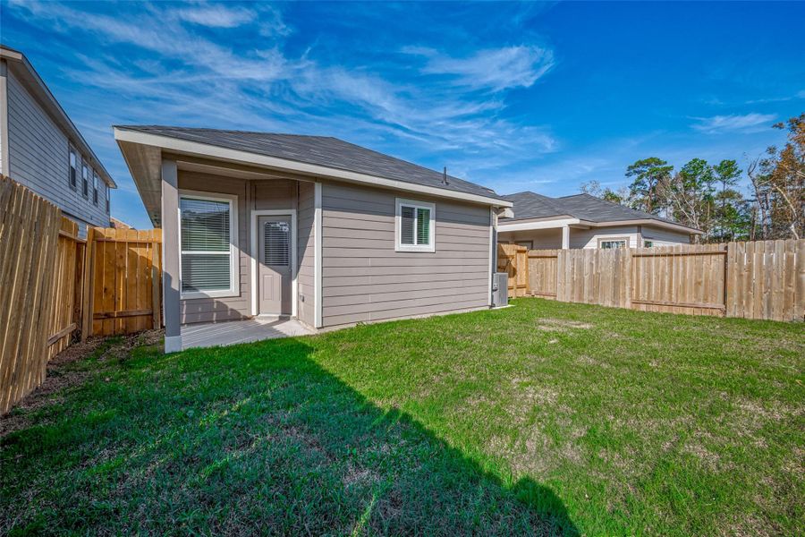 Exterior details and patio area of a home in Mill Creek Trails, Magnolia (Image 3).