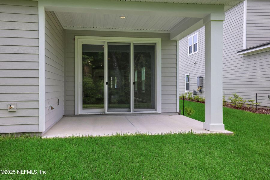 Front exterior of a new home in TrailMark, St. Augustine, FL, highlighting curb appeal (Image 23). Front exterior of a new home in TrailMark, St. Augustine, FL, highlighting curb appeal (Image 23).