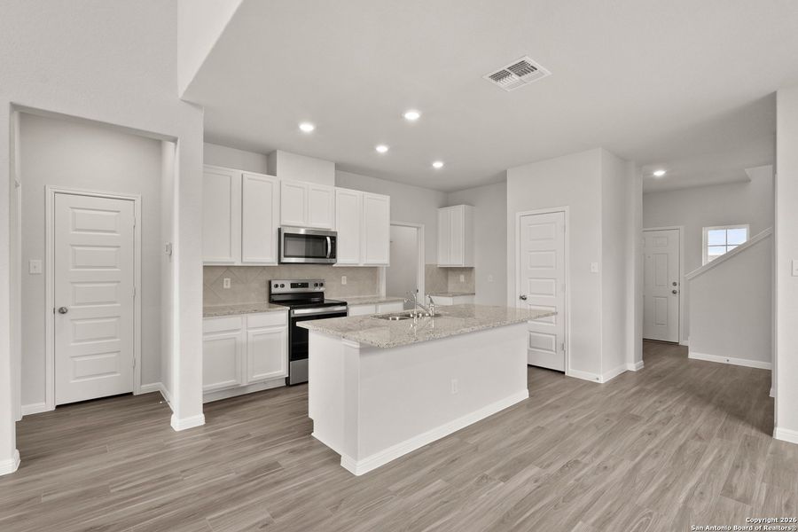 Furnished interior view inside a new home in Cinco Lakes, San Antonio (Image 7).