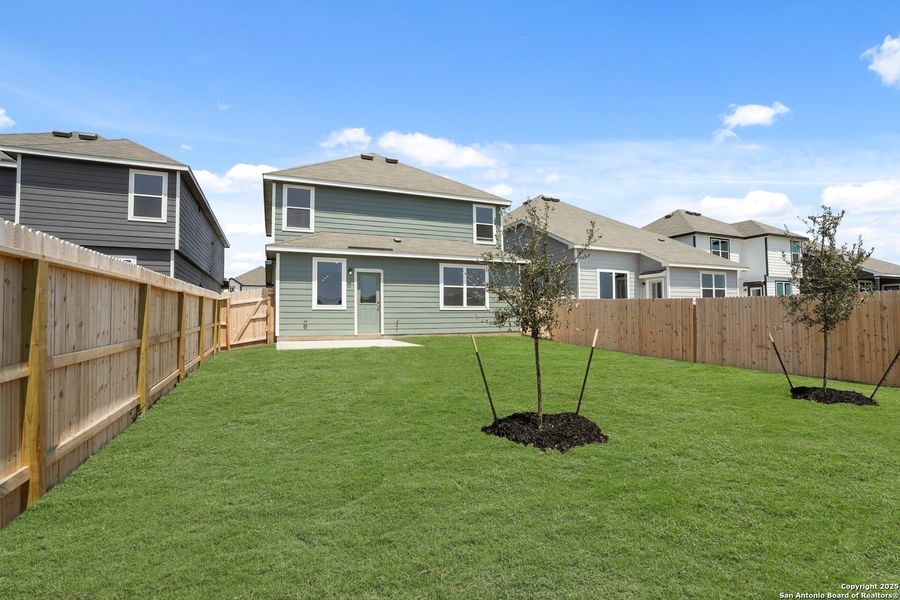 Front exterior of a new home in Abbott Place, St. Hedwig, TX, highlighting curb appeal (Image 1).