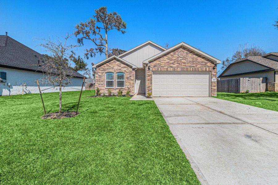 Front exterior of a new home in Columbia Lakes, West Columbia, TX, highlighting curb appeal (Image 2). Front exterior of a new home in Columbia Lakes, West Columbia, TX, highlighting curb appeal (Image 2).