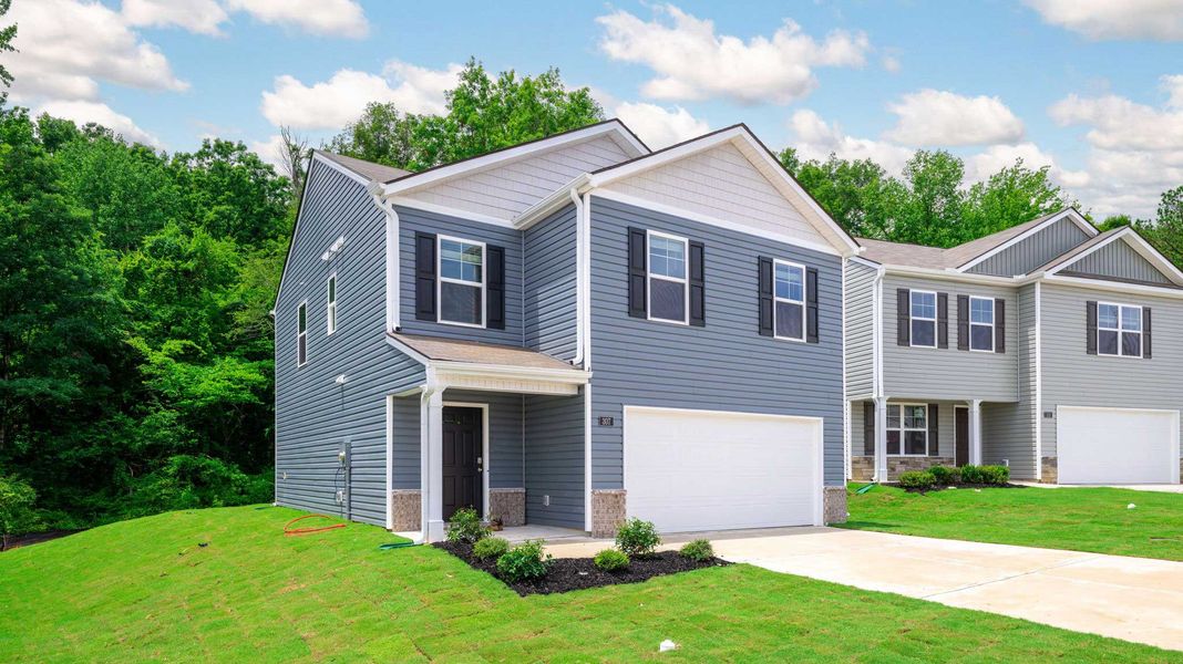 Front exterior of a new home in Hawk's Ridge, Rossville, GA, highlighting curb appeal (Image 2). Front exterior of a new home in Hawk's Ridge, Rossville, GA, highlighting curb appeal (Image 2).