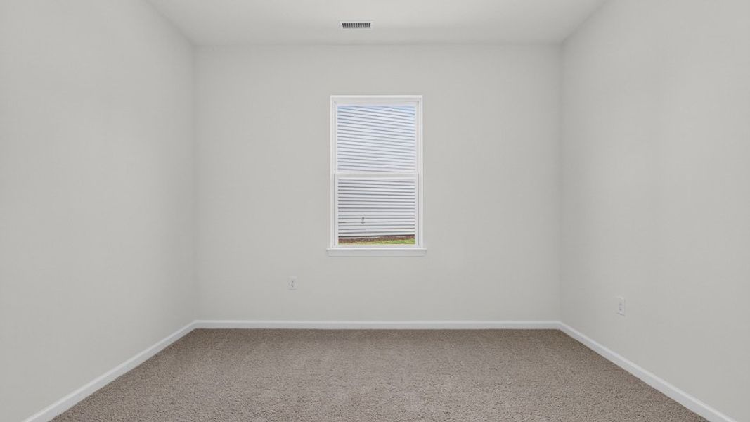 Spacious, unfurnished interior of a new home in The Grove at Matthews Landing, Fuquay Varina (Image 25).