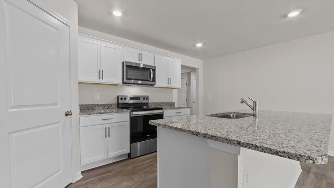 Furnished interior view inside a new home in Blair Ridge, La Grange (Image 9).