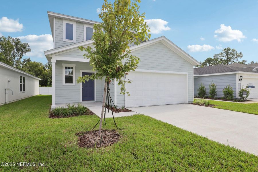 Front exterior of a new home in Kings Crossing, Jacksonville, FL, highlighting curb appeal (Image 2). Front exterior of a new home in Kings Crossing, Jacksonville, FL, highlighting curb appeal (Image 2).