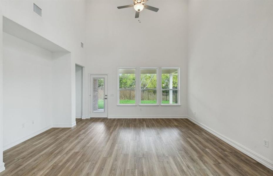 Bright gathering room with large windows *real home pictured