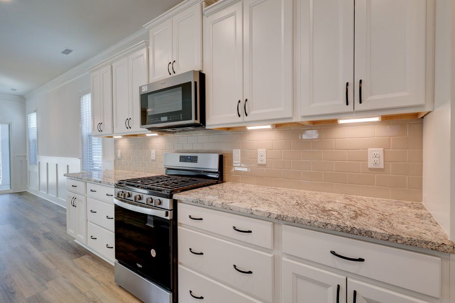 Representative furnished interior of a home built from the Magnolia by McKee Homes in The Walk at East Village, Clayton (Image 2). Representative furnished interior of a home built from the Magnolia by McKee Homes in The Walk at East Village, Clayton (Image 2).
