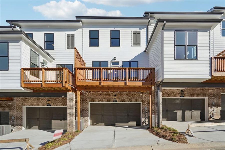 Exterior details and patio area of a home in Palisades Townhomes, Cumming (Image 21).