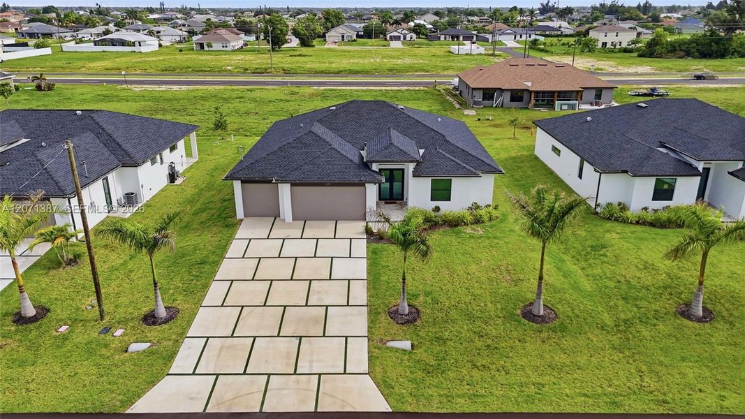 Front exterior of a new home in , Cape Coral, FL, highlighting curb appeal (Image 28).