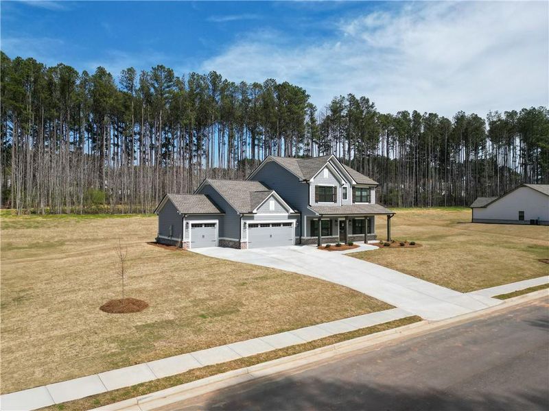 Front exterior of a new home in Weslyn Park, Social Circle, GA, highlighting curb appeal (Image 18).