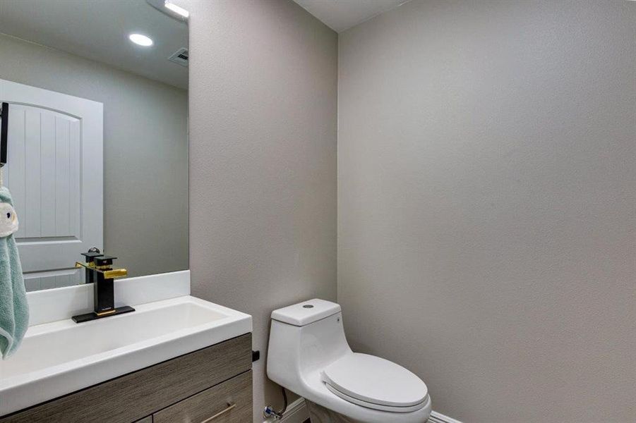 Bathroom featuring vanity and recessed lighting