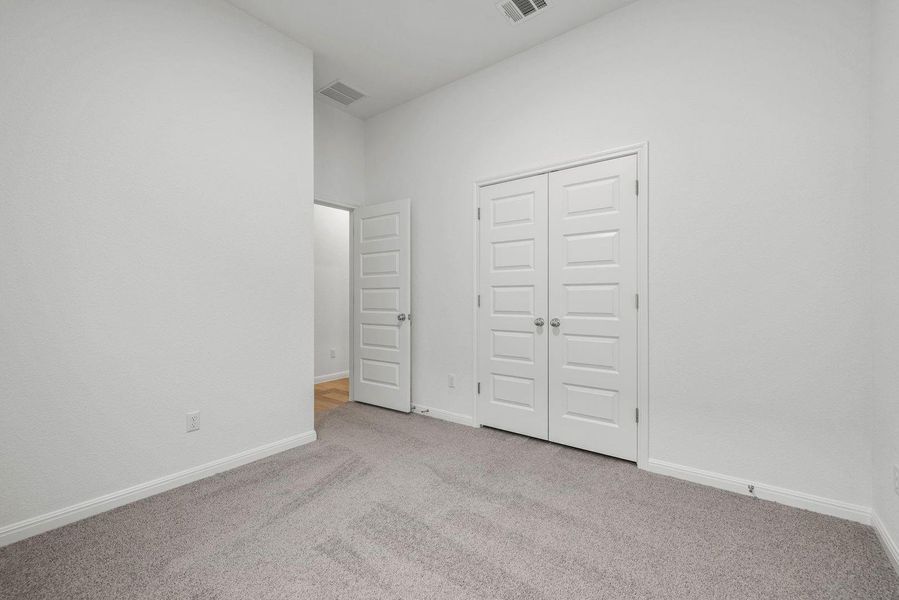 Bedroom in the Quartz home plan by Trophy Signature Homes – REPRESENTATIVE PHOTO Bedroom in the Quartz home plan by Trophy Signature Homes – REPRESENTATIVE PHOTO