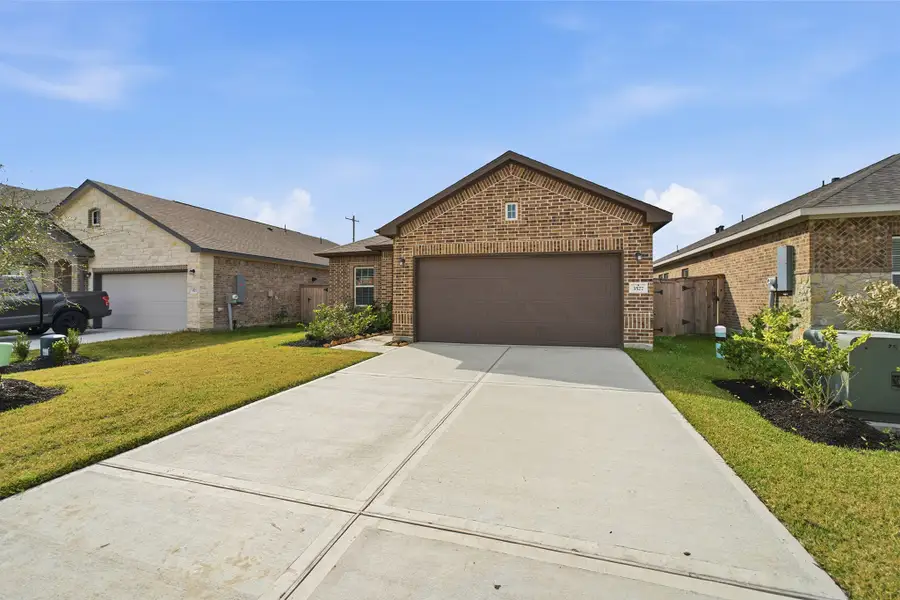 Front exterior of a new home in Windrose Green, Angleton, TX, highlighting curb appeal (Image 15).